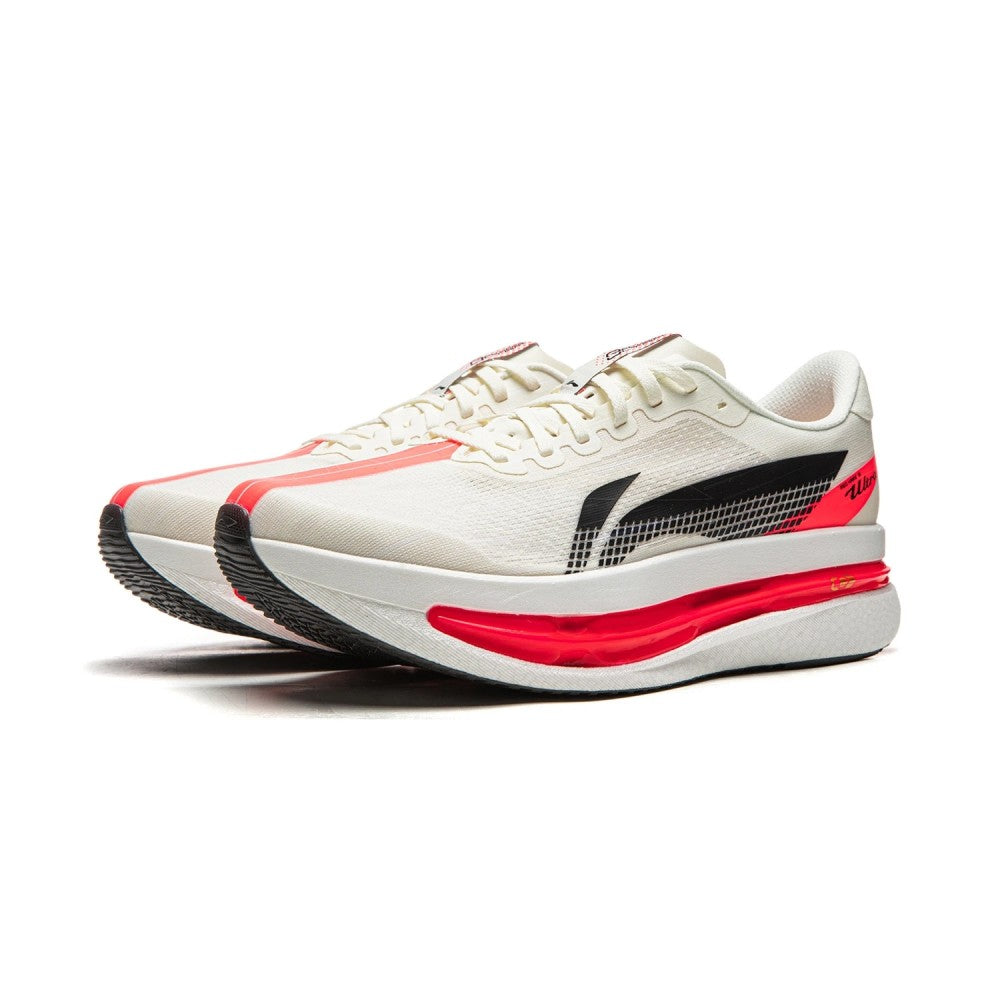 White max cushion running shoe with red and black accents on a white background