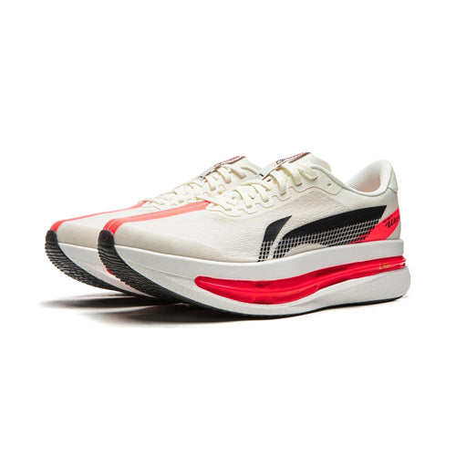 White max cushion running shoe with red and black accents on a white background